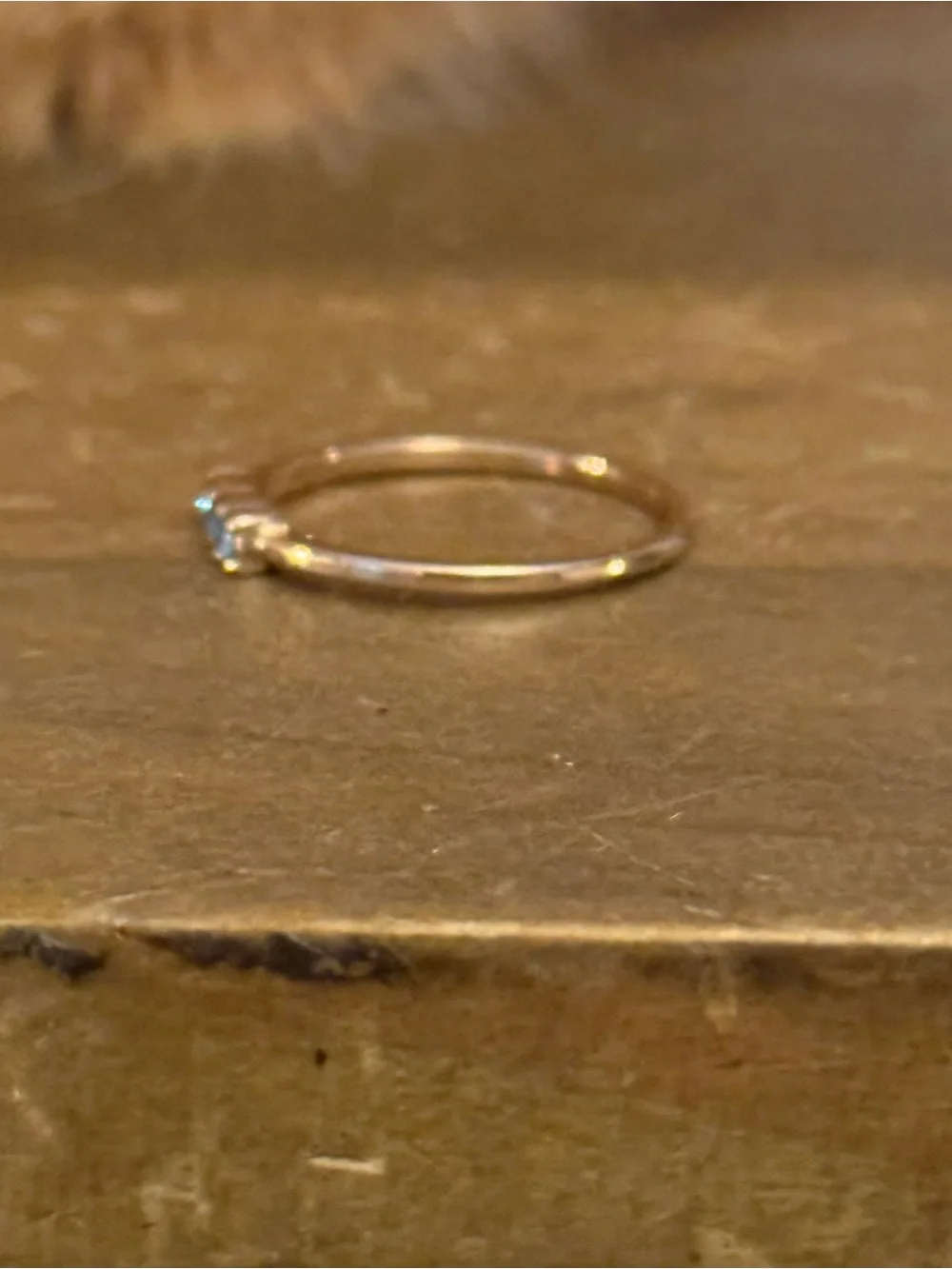 Dainty gold tone triple bezel set aquamarine ring